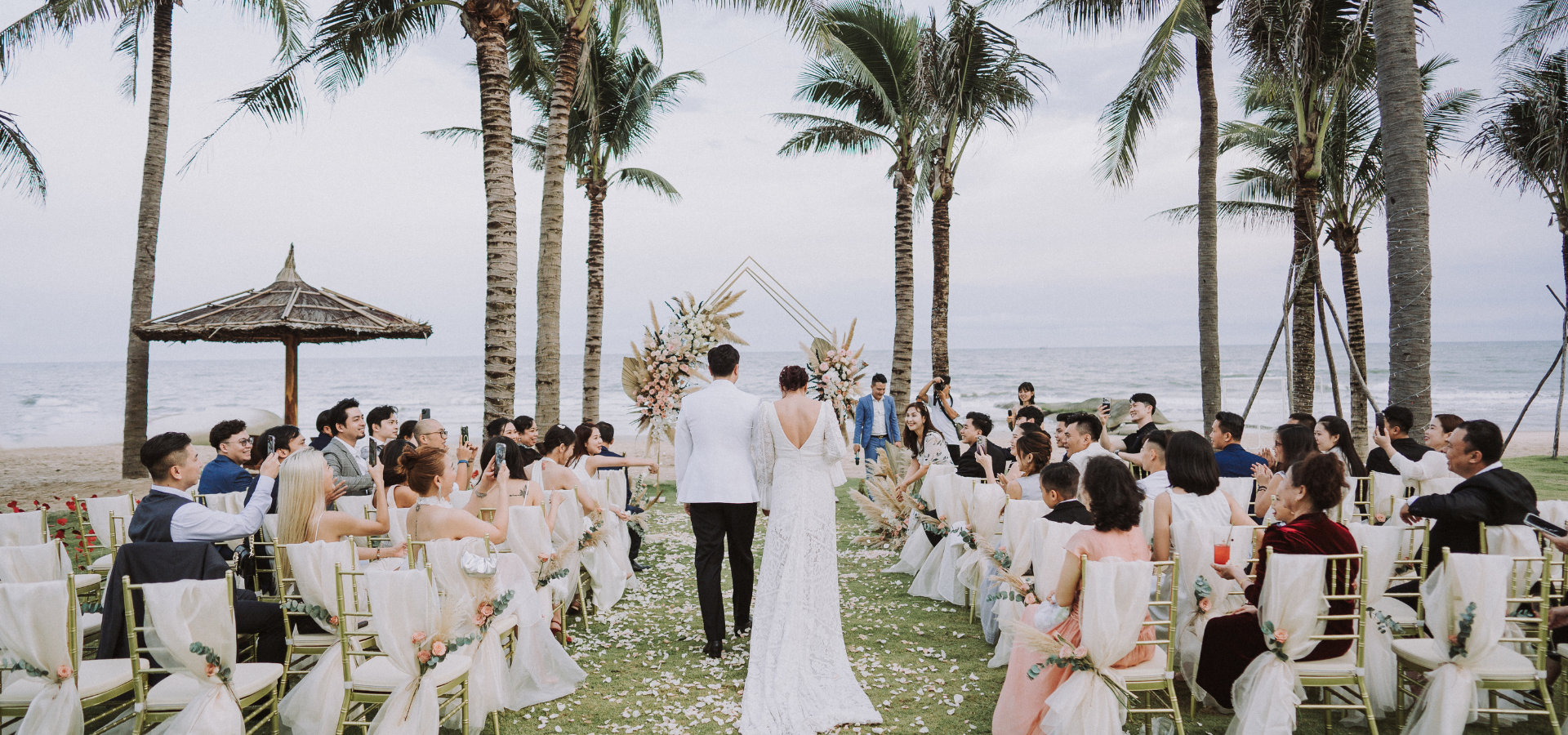 The bride and groom walk down the aisle